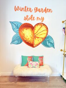 a wall mural saying winter garden stole my heart with the heart being a heart shaped orange