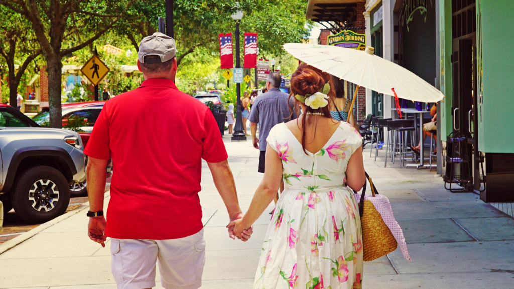 couple walking through downtown hand in hand