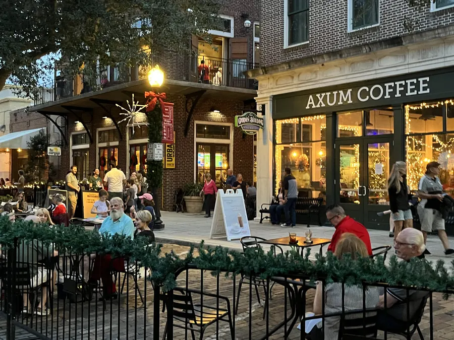 Outdoor seating at a downtown coffee house decorated for the holidays