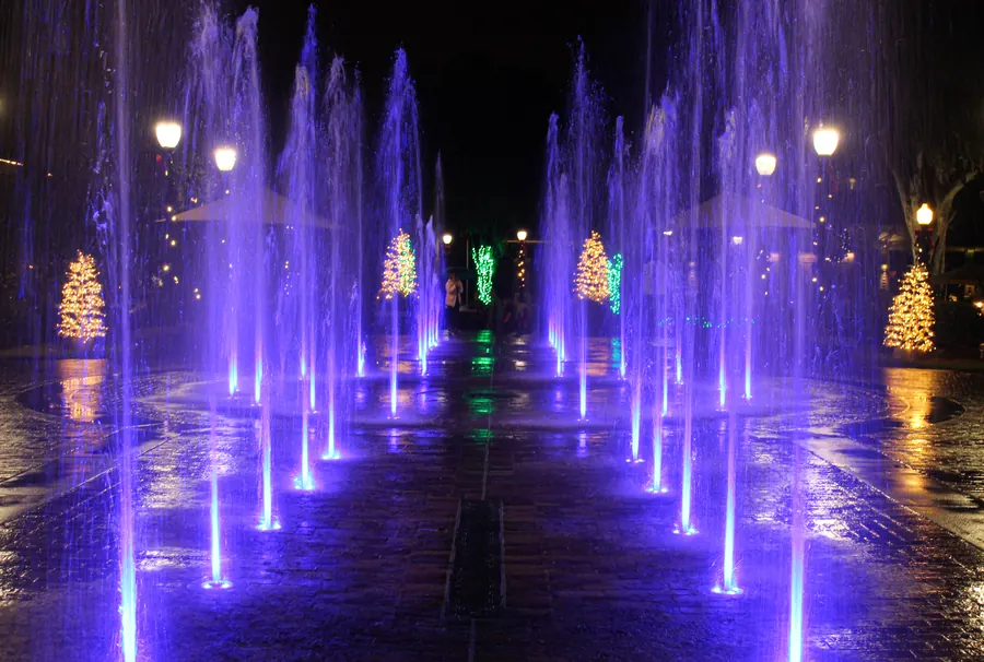 Downtown interactive fountain lit in purple at night