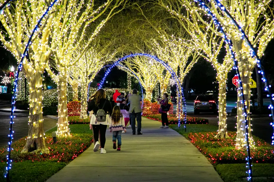 West Orange Trail walkway under a canopy of holiday lights